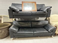 A pair of contemporary black leather settees on metal legs