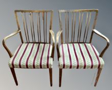 A pair of mid 20th century beech open armchairs with tapestry seats