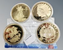 Four oversized commemorative coins - USA 20 Dollars etc (4)