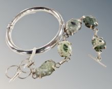 A hollow hinged 925 silver bracelet and a bracelet of polished agate stones in silver mounts