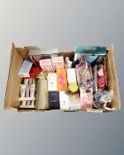 A box of scents and perfumes, sealed sprays etc.