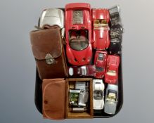 A tray containing diecast model cars, assorted vintage lighters including Ronson,