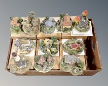 A box containing eleven Danbury Mint cottage ornaments (six boxed with certificates).