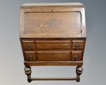 A 20th century oak writing bureau.