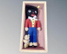 A golly soft toy and a further small Teddy bear in glazed box.