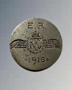 A coin inscribed E R Royal Flying Corps 1916