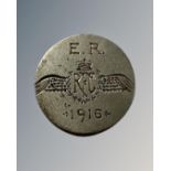 A coin inscribed E R Royal Flying Corps 1916