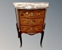A French marquetry inlaid serpentine fronted three drawer chest on raised legs with marble top.
