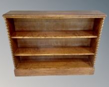 A continental open bookcase with barley twist column supports (identical to the preceding lot)