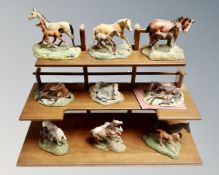 A set of Franklin Mint figures from The World of Horse Series Collection, on stand.
