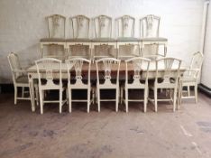 A 20th century continental white and gilt painted extending dining table,