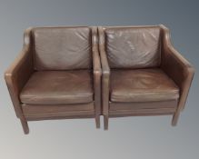 A pair of 20th century Danish armchairs upholstered in brown leather