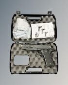 A Umarex Colt 1911 .177 calibre air pistol, in box with instructions and CO2 canisters.