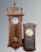 A 19th century oak enamelled dial wall clock together with a further wall clock,