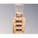 An antique pine hanging corner cupboard together with an Ibex kitchen chair