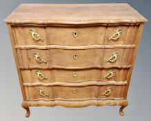 A 19th century oak serpentine fronted four drawer chest