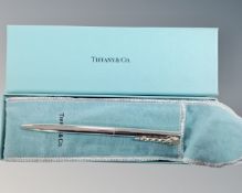 A Tiffany & Co silver ballpoint pen, boxed.