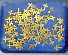 A quantity of miniature brass crosses