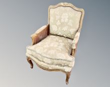 A 19th century gilded bergere armchair