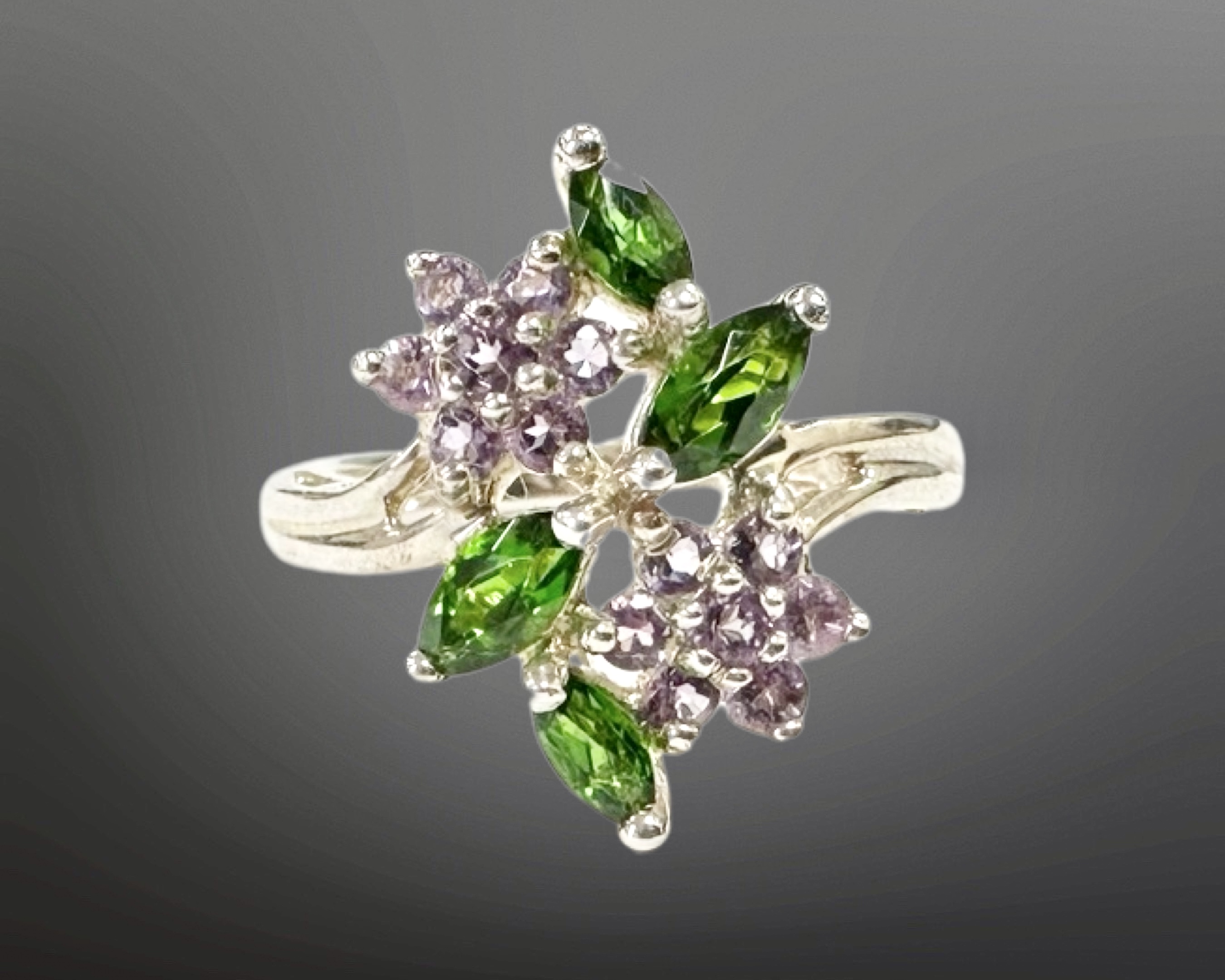 A silver amethyst and tourmaline ring, size K.