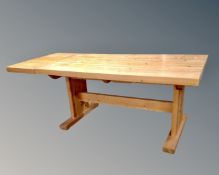 A pine farmhouse style table with extension leaf