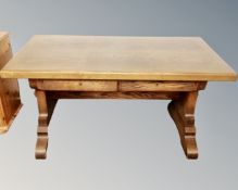 A mid century heavy carved oak refectory table