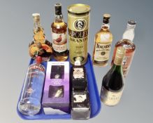 A collection of alcohol to include Famous Grouse whisky, Smirnoff vodka,