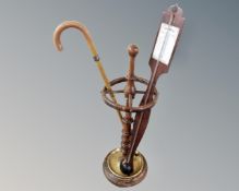 An early 20th century stick stand together with a stick barometer and a stick