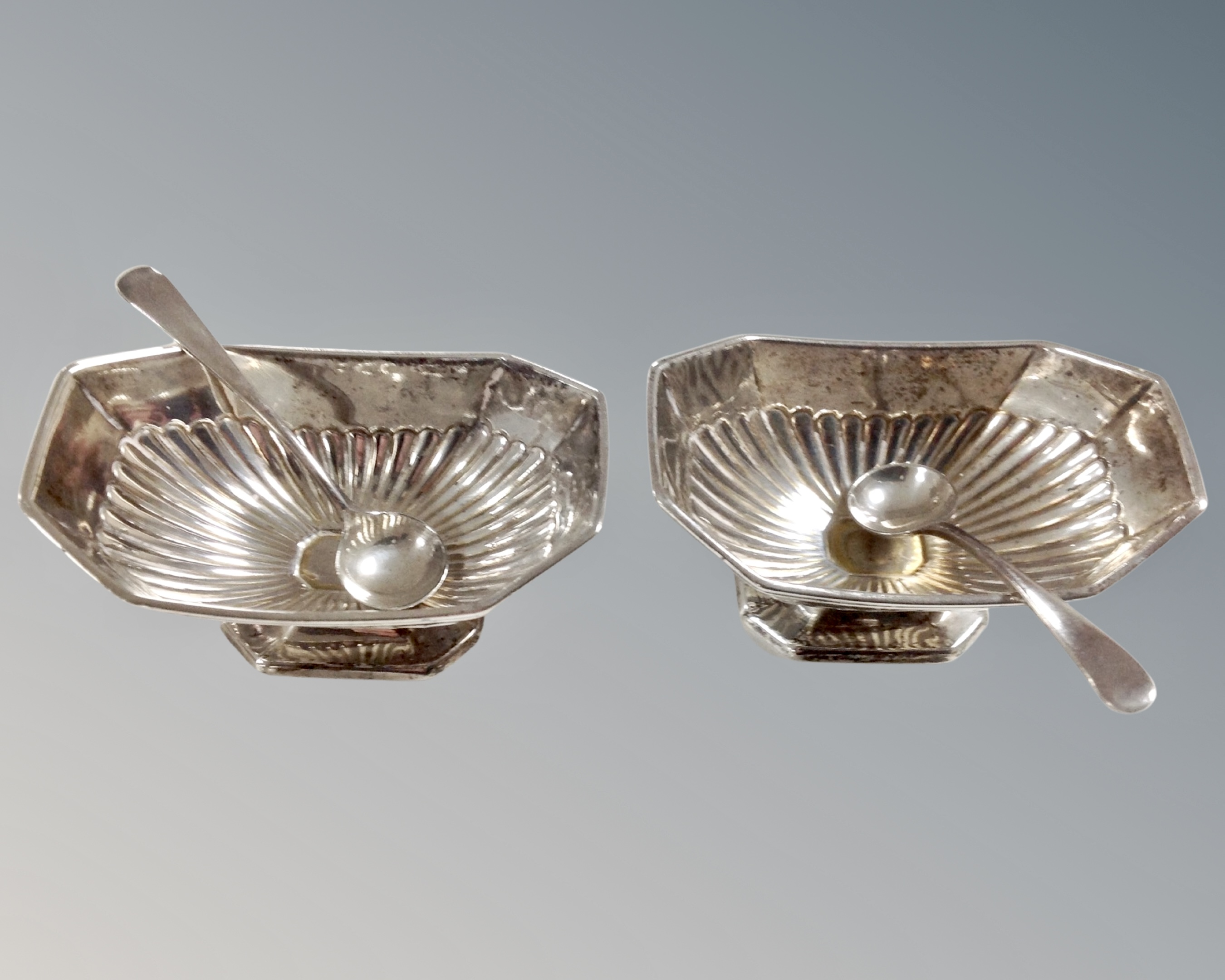 A pair of London silver salts with plated spoons