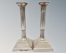 A pair of silver plated Corinthian column candlesticks