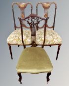 A pair of Victorian inlaid mahogany dining chairs together with a further chair