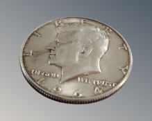 A 1964 Kennedy half silver dollar