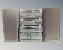A Tecnhics four piece separate system with speakers
