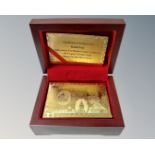 A set of gold foil coated playing cards in box