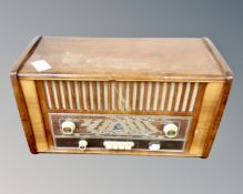 A vintage walnut cased valve radio