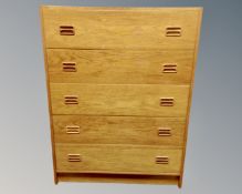 A mid century Danish five drawer chest