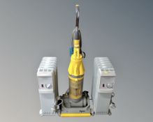 A Dyson DC7 vacuum together with two oil filled radiators