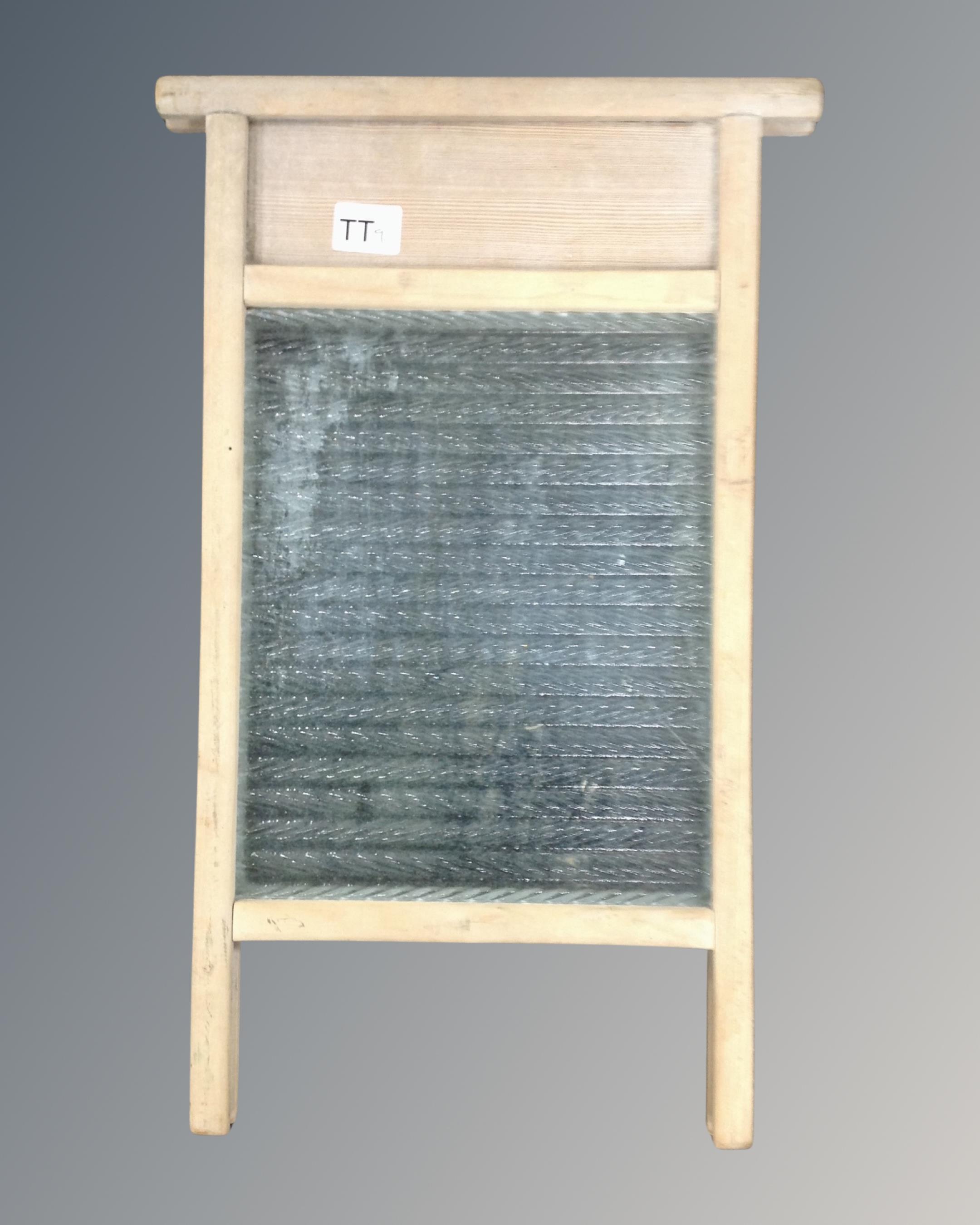 A vintage pine and glass wash board