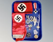 A tray of reproduction German WW II medals, badges,