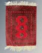 A small Afghan Bokhara hearth rug,