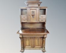 A Victorian carved oak side cabinet