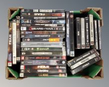 A box of Playstation games,
