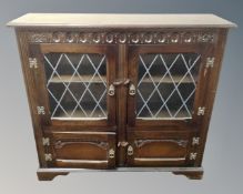 A 20th century double leaded glass door bookcase
