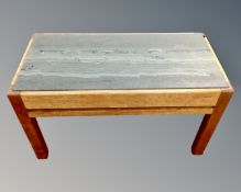 A 20th century teak coffee table with slate insert