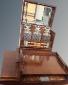 A 19th century fitted decanter box containing three cut glass decanters,