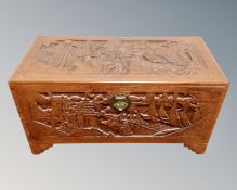 A carved camphor wood blanket box