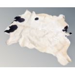 A cow hide rug