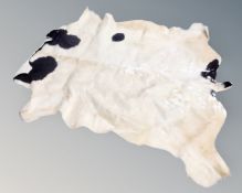 A cow hide rug