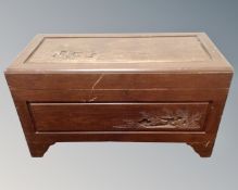 A carved camphor wood blanket box