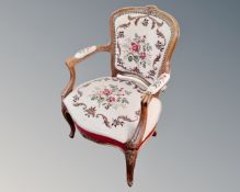 A Continental carved beech tapestry upholstered chair